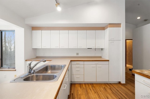 kitchen with light countertops and white cabinetry