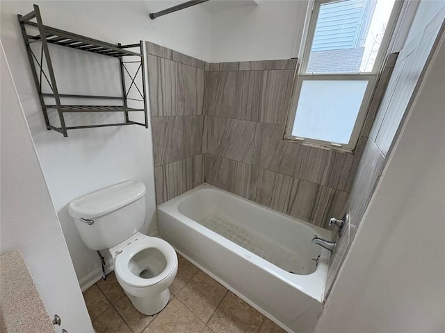 full bathroom featuring washtub / shower combination, tile patterned flooring, and toilet