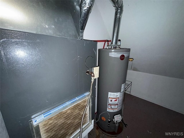 utility room featuring water heater