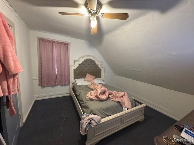 bedroom featuring a ceiling fan, lofted ceiling, and baseboards