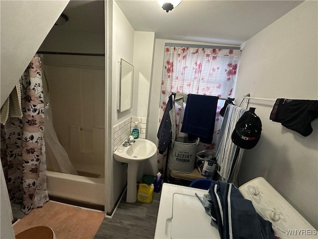 bathroom featuring shower / tub combo with curtain and wood finished floors