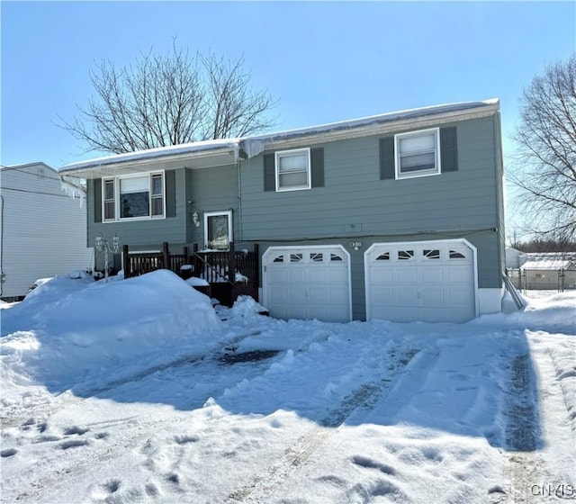 bi-level home featuring an attached garage