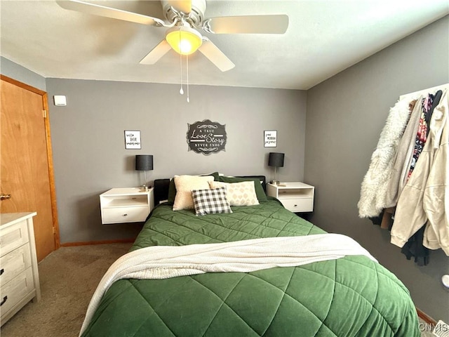 carpeted bedroom with a ceiling fan