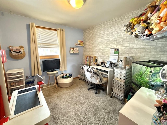 home office with brick wall, baseboards, and carpet flooring