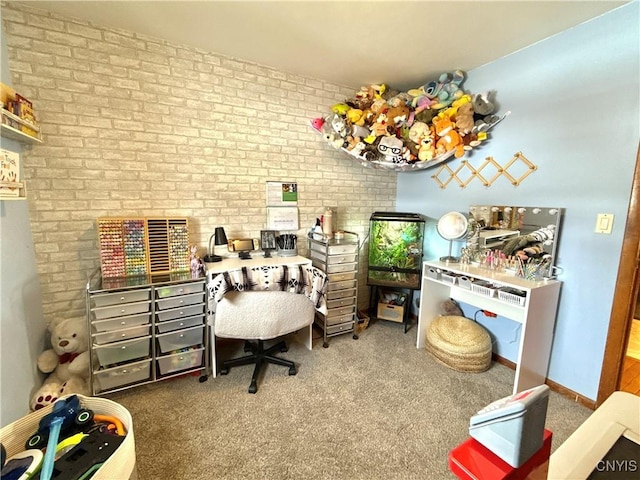 carpeted office space with baseboards and brick wall