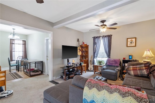 213 Salisbury St, Sandy Creek, NY 13145 - living room with beamed ceiling, baseboards, light carpet, and ceiling fan with notable chandelier