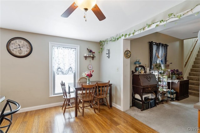 213 Salisbury St, Sandy Creek, NY 13145 - dining room with baseboards, a ceiling fan, a wealth of natural light, and stairway