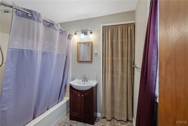 full bath featuring shower / bath combo with shower curtain and vanity