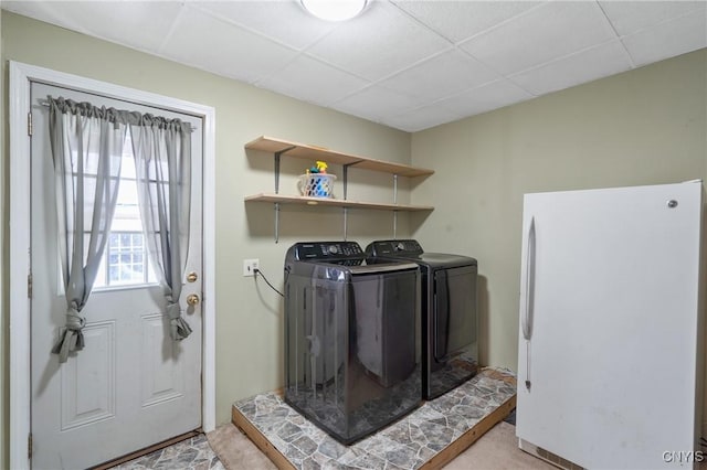 washroom with laundry area and washer and clothes dryer