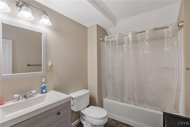 bathroom featuring toilet, shower / bath combo with shower curtain, and vanity