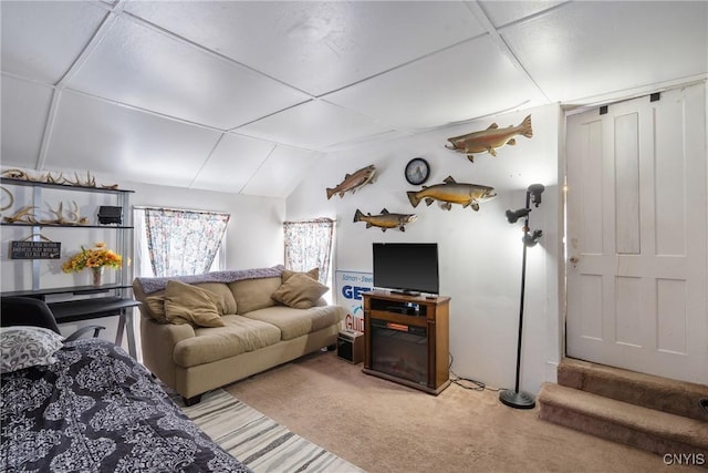 living area featuring lofted ceiling and light carpet