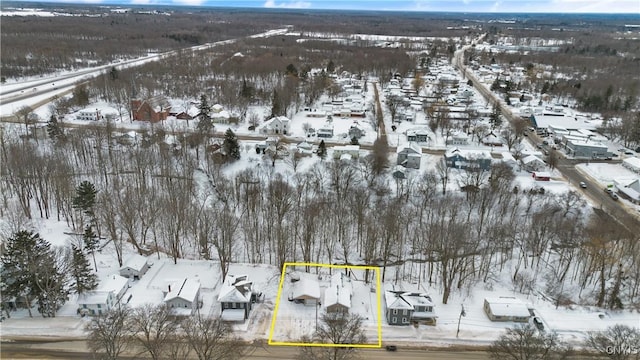 snowy aerial view with a residential view