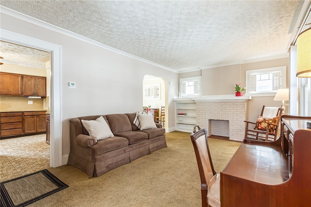 living area with light carpet, arched walkways, ornamental molding, a textured ceiling, and a brick fireplace