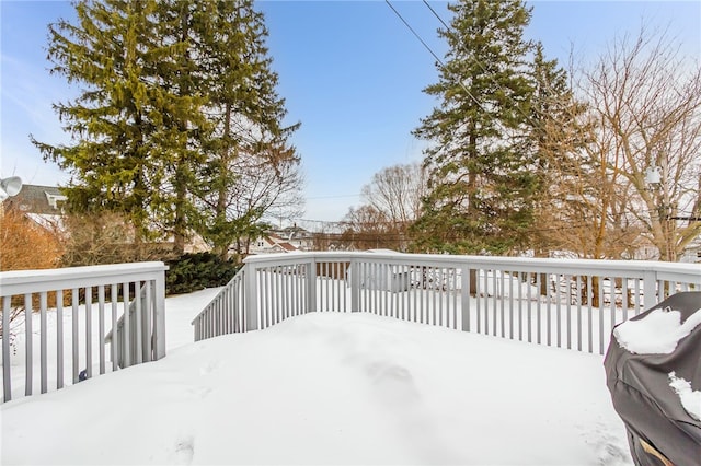 snow covered deck with grilling area