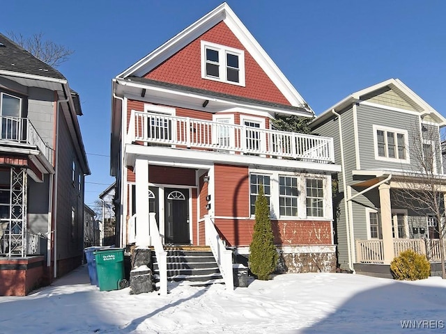 view of front of house featuring a balcony