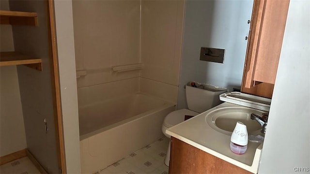 bathroom featuring washtub / shower combination, vanity, and toilet