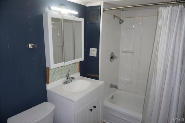 bathroom with shower / tub combo, vanity, toilet, and decorative backsplash