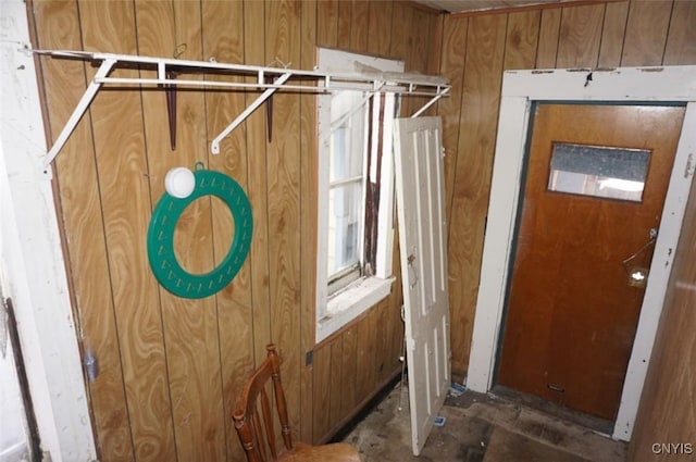 interior space featuring wood walls