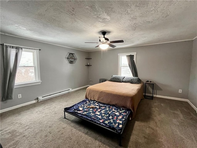 carpeted bedroom with a textured ceiling, multiple windows, baseboard heating, and baseboards