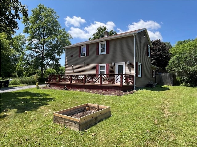493 Prospect Hill Rd, Catlin, NY 14845 - rear view of property featuring a wooden deck and a vegetable garden