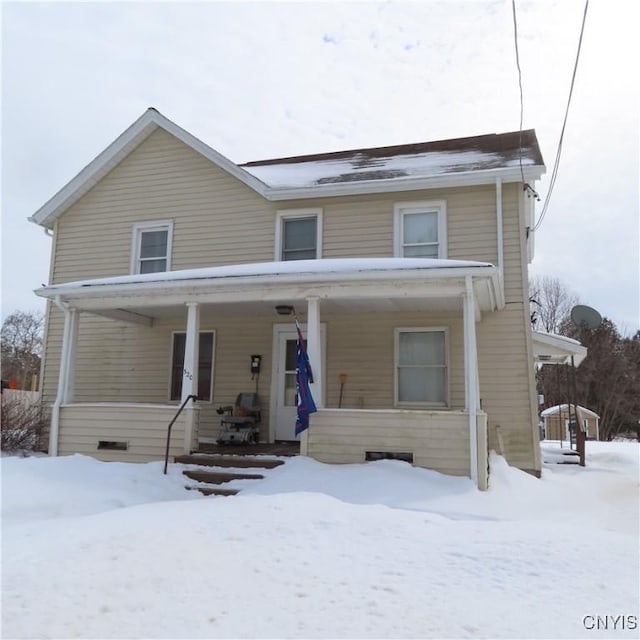 view of front of house featuring covered porch and crawl space