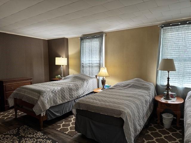 bedroom with wood finished floors