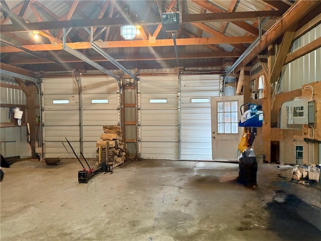 garage with metal wall and a garage door opener