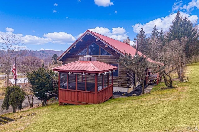 3391 State Route 28, Herkimer, NY 13350 - rear view of house featuring a chimney, log siding, metal roof, a yard, and a gazebo