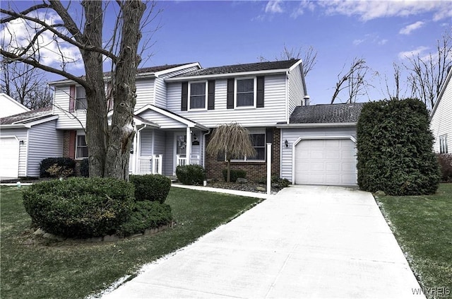 traditional home with a front lawn, concrete driveway, brick siding, and an attached garage