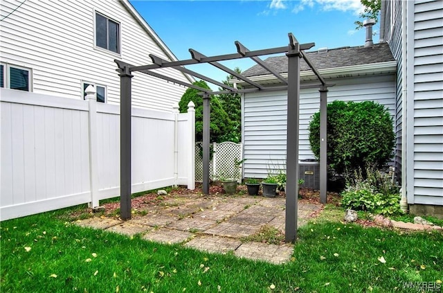 view of patio featuring fence and a pergola