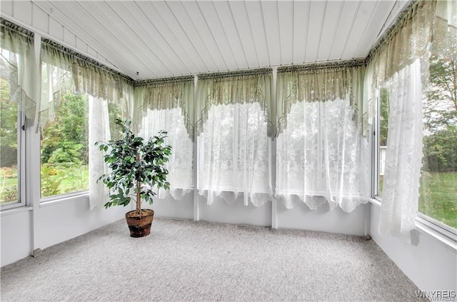 sunroom / solarium featuring wooden ceiling