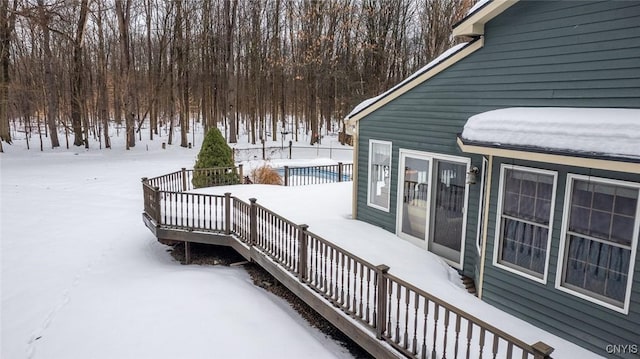 snow covered deck with stairway