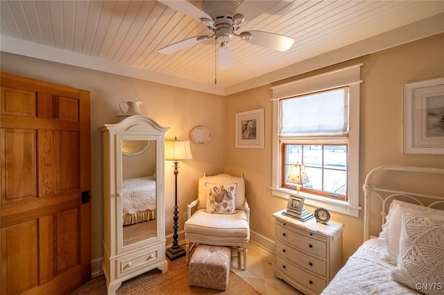 bedroom featuring a ceiling fan, wood ceiling, and baseboards