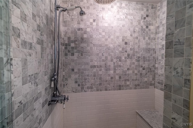 bathroom featuring a tile shower