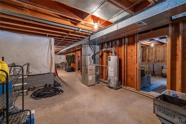 unfinished basement featuring heating unit and gas water heater