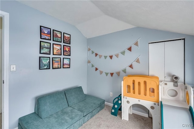 rec room with carpet flooring and vaulted ceiling