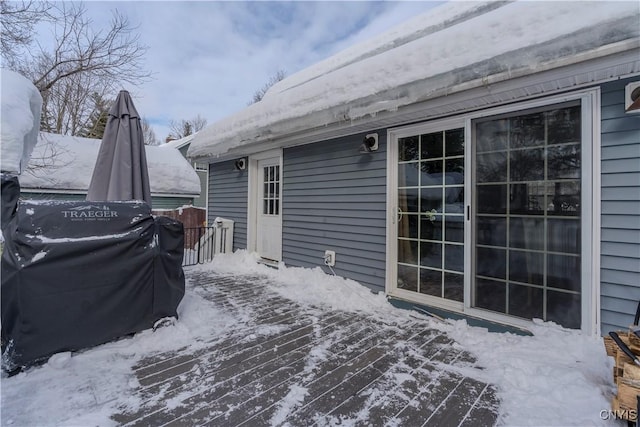 view of snow covered deck