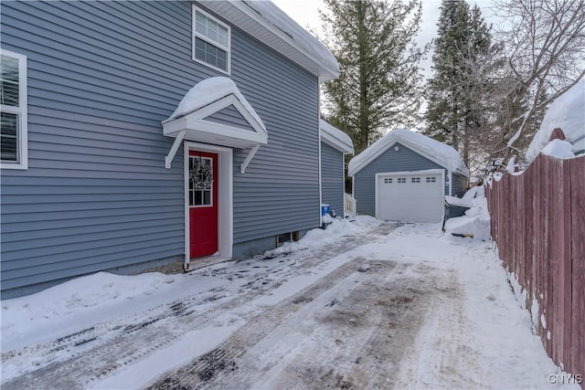 exterior space with a garage and fence