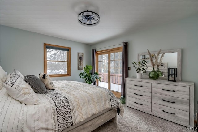 bedroom featuring access to exterior and carpet