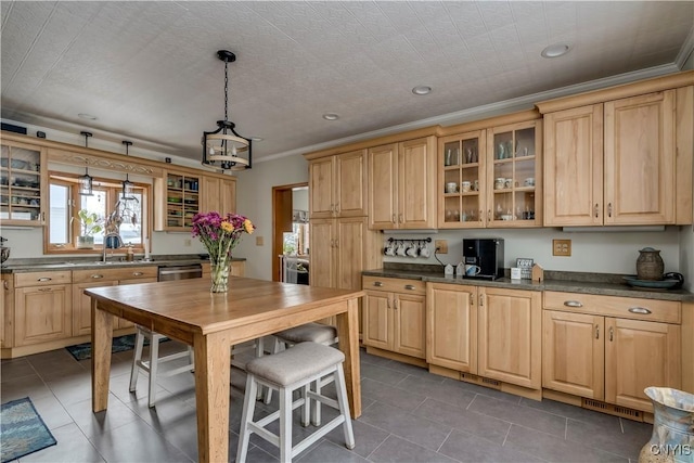 kitchen featuring stainless steel dishwasher, dark countertops, glass insert cabinets, and crown molding