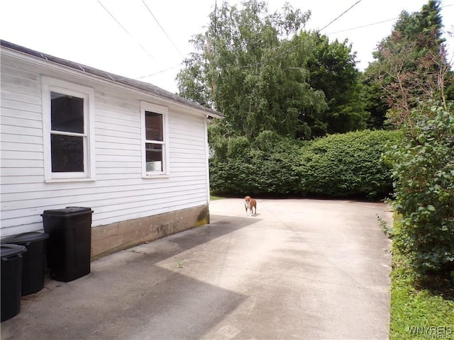 view of side of home featuring a patio area