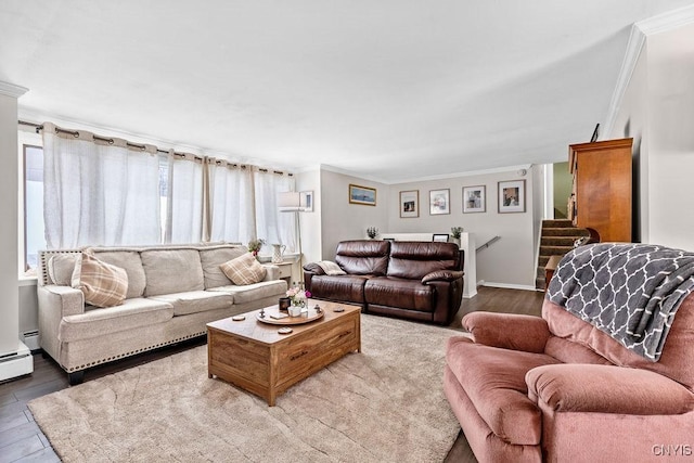 living area with ornamental molding, a baseboard radiator, wood finished floors, and stairs