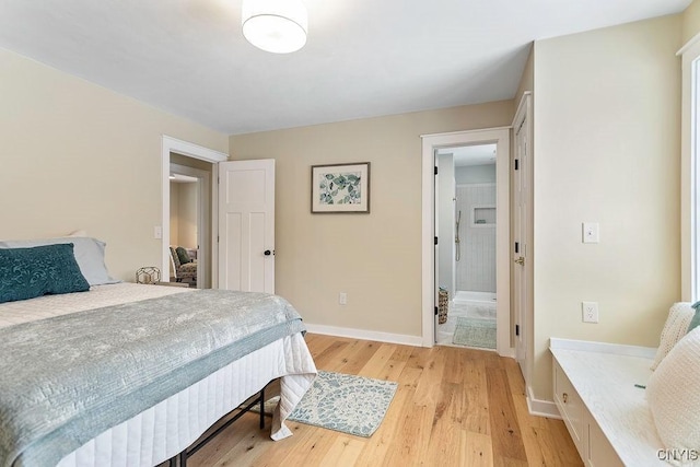 bedroom featuring light wood-type flooring and baseboards