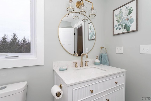 half bath with vanity and toilet