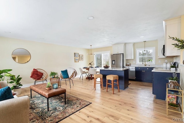 living room with light wood-style floors and baseboards