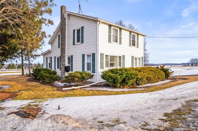 view of front of home with a chimney