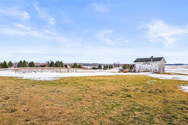 view of yard with a rural view and volleyball court