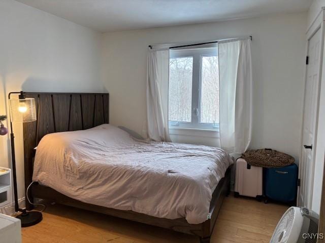 bedroom featuring light wood finished floors