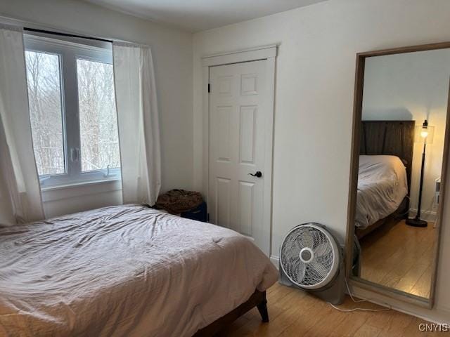 bedroom with wood finished floors