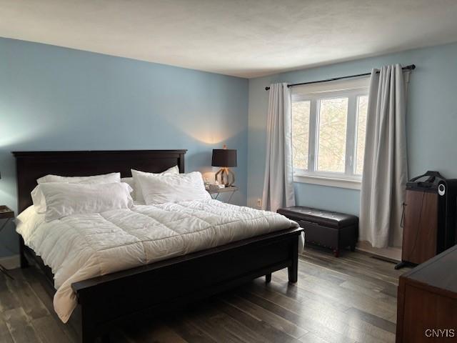 bedroom with wood finished floors